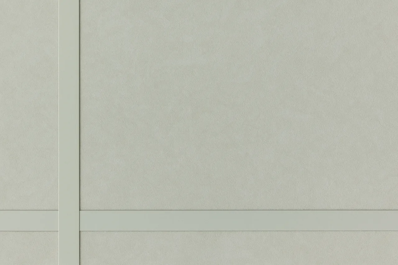 Two circular panels made from white fibrous material, overlapping slightly and featuring intricate texture, placed against a minimalistic light grey background.