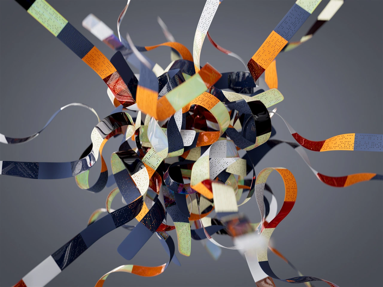 An abstract art installation made from colorful, curved metallic strips, arranged in a spherical, chaotic form, set against a dark background.